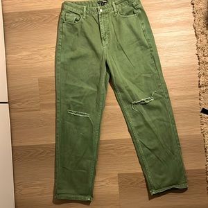 Women’s green ripped jeans